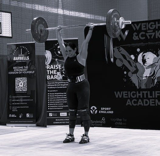 Our coach Rosie competing in a powerlifting competition